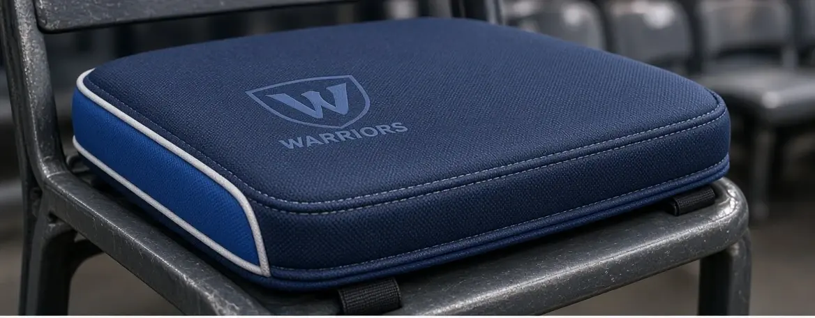 Stadium seat cushion printed with a school shield and wordmark